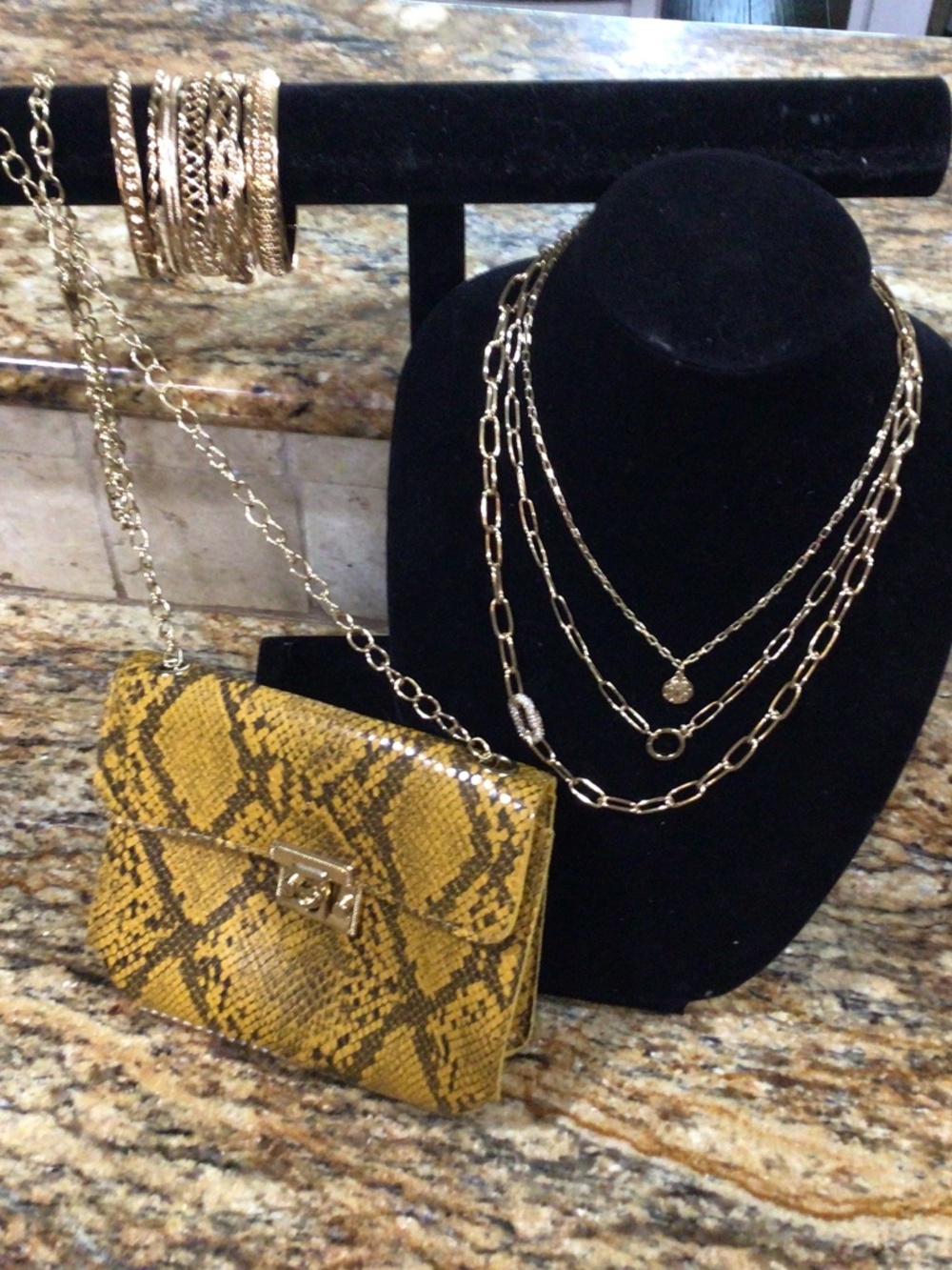Purse, bracelets and necklace. All gold tone and in perfect shape.